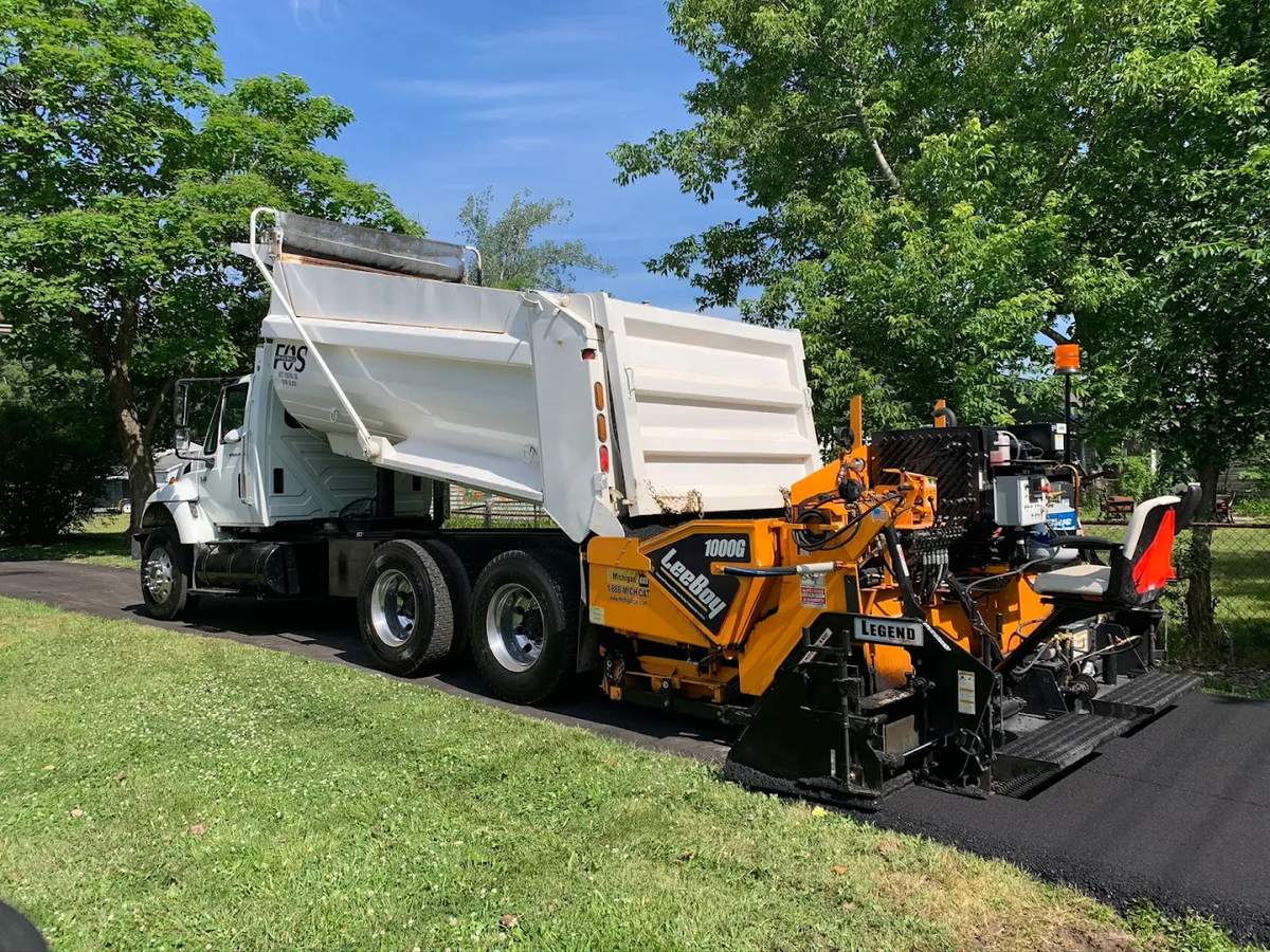 Black Rock Paving truck and paver on a job site