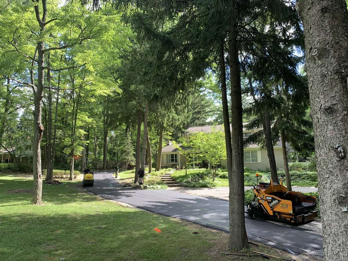 Freshly paved residential asphalt driveway